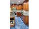 Featuring a granite island, stainless appliances, and wooden cabinetry at 985 Lake Haven Ct, Roswell, GA 30076