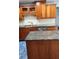 Kitchen featuring stainless appliances, granite countertops, and custom cabinets at 985 Lake Haven Ct, Roswell, GA 30076