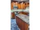 Well-equipped kitchen featuring stainless steel appliances, custom cabinetry, and a granite island at 985 Lake Haven Ct, Roswell, GA 30076