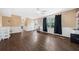 Spacious living room features hardwood floors, decorative molding, and natural light from large windows at 985 Lake Haven Ct, Roswell, GA 30076