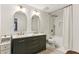 Elegant bathroom with double vanity, modern fixtures, and a shower-tub combination with decorative tiling at 2901 Lenox Rd # 1002, Atlanta, GA 30324