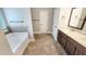 Relaxing bathroom with a soaking tub, tile floors, and a double sink vanity, perfect for comfort at 2897 Austin Common Dr, Dacula, GA 30019
