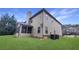 Exterior of home with well-maintained lawn and a screened-in porch for outdoor enjoyment at 2897 Austin Common Dr, Dacula, GA 30019