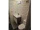 Stylish bathroom features a modern vanity with a black faucet, white subway tile walls, and a black honeycomb floor at 32 Peachtree Nw St # 705, Atlanta, GA 30303