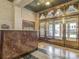 Grand lobby with a marble reception desk and brass-framed doors, reflecting the building's 1930s architectural style at 32 Peachtree Nw St # 705, Atlanta, GA 30303