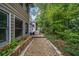 View of the home's exterior and backyard with pea gravel path that leads to the outbuilding at 3278 Winter Wood Ct, Marietta, GA 30062