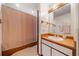 Traditional bathroom featuring wood-look vanity, mirror, and shower with curtain at 3278 Winter Wood Ct, Marietta, GA 30062