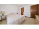 Bedroom featuring a twin bed, white bookcase, and closet in neutral tones at 3278 Winter Wood Ct, Marietta, GA 30062