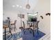 Bright dining area featuring modern light fixture, adjacent bar seating, and seamless transition to the kitchen at 3278 Winter Wood Ct, Marietta, GA 30062