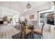 Bright dining area with glass table, chandelier and large windows at 3278 Winter Wood Ct, Marietta, GA 30062