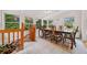 Sunroom dining area with tile floors, dining table, and many windows offering natural light at 3278 Winter Wood Ct, Marietta, GA 30062