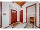 Foyer with wooden front door, tiled floor, and view to a bedroom at 3278 Winter Wood Ct, Marietta, GA 30062