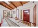 Inviting foyer showcases vaulted wood ceilings, a colorful rug, and access to other rooms at 3278 Winter Wood Ct, Marietta, GA 30062