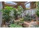 Beautiful sunroom with mature plantings, tile floor, and a skylight at 3278 Winter Wood Ct, Marietta, GA 30062