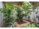 Lush greenhouse with natural light, tropical plants, and unique setup for plant enthusiasts at 3278 Winter Wood Ct, Marietta, GA 30062