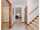 Hallway with view of a living space, a staircase, and access to other rooms at 3278 Winter Wood Ct, Marietta, GA 30062