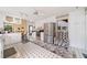 Well-lit kitchen showcasing white cabinets, stainless steel appliances, and unique patterned flooring at 3278 Winter Wood Ct, Marietta, GA 30062