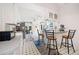 Open kitchen area with stainless steel appliances, bar seating, and a seamless transition to the dining area at 3278 Winter Wood Ct, Marietta, GA 30062