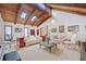 Cozy living room with a vaulted wood ceiling, white sofas, fireplace, and lots of natural light at 3278 Winter Wood Ct, Marietta, GA 30062