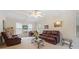 Inviting living room featuring a coffered ceiling, ceiling fan, and comfortable seating at 3278 Winter Wood Ct, Marietta, GA 30062