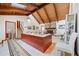 Open living room with wood ceilings, skylight, and stone fireplace feature at 3278 Winter Wood Ct, Marietta, GA 30062