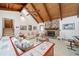 Cozy living room with stone fireplace, vaulted wood ceilings, and comfortable seating arrangement at 3278 Winter Wood Ct, Marietta, GA 30062