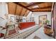 Open living room with wood ceilings, skylight, and a stone fireplace at 3278 Winter Wood Ct, Marietta, GA 30062