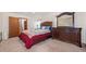 Cozy main bedroom with a wooden dresser, large mirror and comfortable bed at 3278 Winter Wood Ct, Marietta, GA 30062
