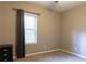 Neutral bedroom featuring window views and black cabinet at 257 Stone Park Dr, Woodstock, GA 30188