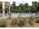 A community pool with numerous chairs shown behind a black fence surrounded by trees at 257 Stone Park Dr, Woodstock, GA 30188