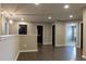 Bright hallway with hardwood floors, modern lighting, and neutral paint at 257 Stone Park Dr, Woodstock, GA 30188