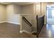 Hallway with dark wood floors, a railing, and neutral paint at 257 Stone Park Dr, Woodstock, GA 30188