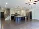 Modern kitchen features stainless steel appliances, large island, and open layout at 257 Stone Park Dr, Woodstock, GA 30188