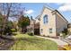 Manicured backyard featuring a lush lawn, multi-level deck, and beautifully landscaped flowerbeds at 2770 Wooded Hills Walk, Marietta, GA 30062