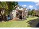 Brick home with a large backyard, deck, patio, and green lawn at 2770 Wooded Hills Walk, Marietta, GA 30062
