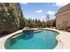 Large backyard pool and patio area surrounded by lush trees and landscaping at 2770 Wooded Hills Walk, Marietta, GA 30062