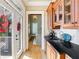 Stylish bar area with wooden cabinets, black granite countertop, sink, and access to the deck through glass doors at 2770 Wooded Hills Walk, Marietta, GA 30062