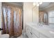 Bathroom vanity with white counter and bathtub with shower at 2770 Wooded Hills Walk, Marietta, GA 30062