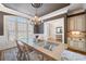 Elegant dining room featuring plantation shutters, a chandelier, and a view to the home's entryway at 2770 Wooded Hills Walk, Marietta, GA 30062