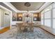 Sophisticated dining room with a chandelier, large windows, and a stylish rug at 2770 Wooded Hills Walk, Marietta, GA 30062