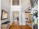 Grand foyer with soaring ceilings, detailed trim work, hardwood floors, and elegant architectural features at 2770 Wooded Hills Walk, Marietta, GA 30062
