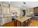 Elegant kitchen features a granite island, stainless steel appliances, and custom cabinetry at 2770 Wooded Hills Walk, Marietta, GA 30062
