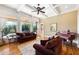 Inviting living room featuring coffered ceilings, large windows with curtains, and hardwood floors at 2770 Wooded Hills Walk, Marietta, GA 30062