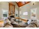 Bright living room with a stone fireplace, vaulted ceiling, hardwood floors, large windows, and a comfortable sectional at 2770 Wooded Hills Walk, Marietta, GA 30062