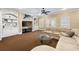 A Gathering room with a mounted marlin decoration, a beige sectional, and built in shelving at 2770 Wooded Hills Walk, Marietta, GA 30062