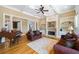 Comfortable living room with a fireplace, built-in shelving, hardwood floors, and natural light at 2770 Wooded Hills Walk, Marietta, GA 30062