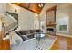 Inviting living room with a stone fireplace, high vaulted ceilings, hardwood floors, and a comfortable sectional sofa at 2770 Wooded Hills Walk, Marietta, GA 30062