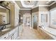 Elegant main bathroom with double sinks, a soaking tub, and a glass-enclosed shower at 2770 Wooded Hills Walk, Marietta, GA 30062
