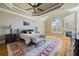 Luxurious main bedroom with a tray ceiling, fireplace, and hardwood floors at 2770 Wooded Hills Walk, Marietta, GA 30062