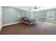 Spacious main bedroom featuring neutral colored walls, carpet, a ceiling fan, and canopy bed at 2770 Wooded Hills Walk, Marietta, GA 30062